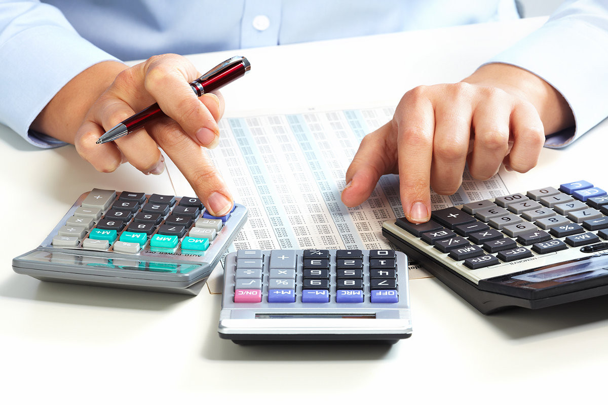 Hand with calculator. Finance and accounting business.