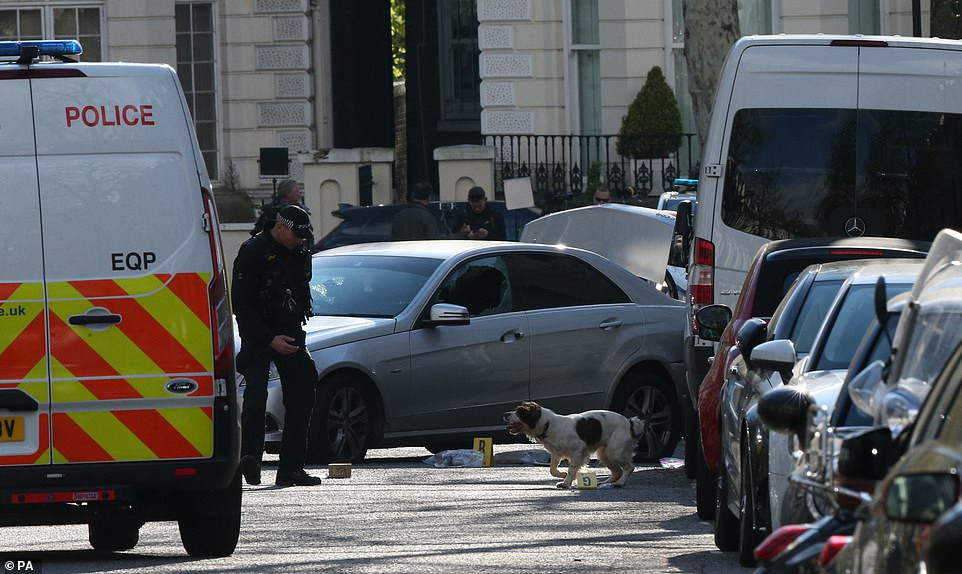 7f19a3a-12235392-6918983-a-police-sniffer-dog-at-the-scene-near-the-ukrainian-embassy-in--a-4-1555225791545