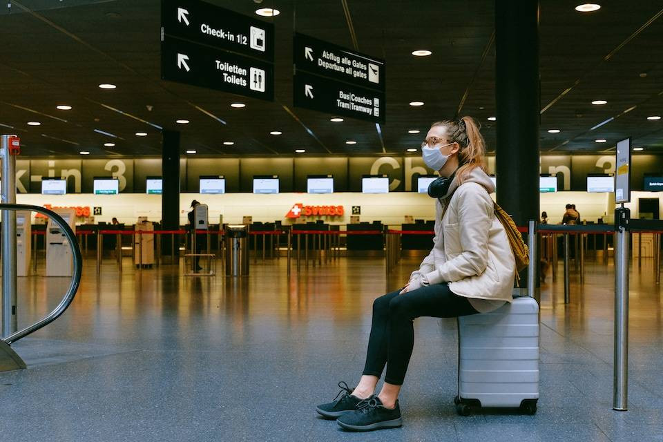 woman-sitting-on-luggage-3943882